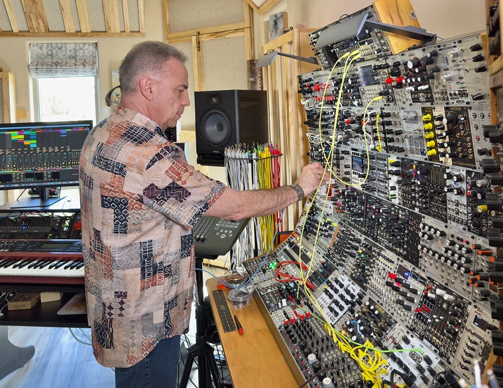 Chris patching his large studio modular synthesizer at the tracking end of the studio.